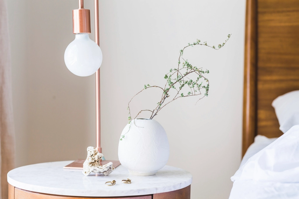 Warm bedside lamp on a night table