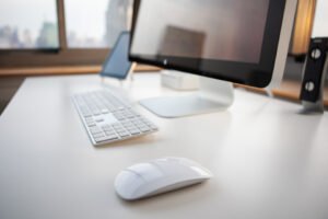 Monitor positioned above a tidy desk